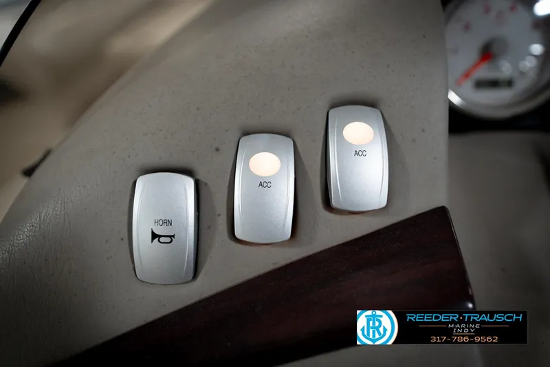 Slide: The Image of Control panel of a 2006 Bennington 2250RL with horn and accessory switches. - 32