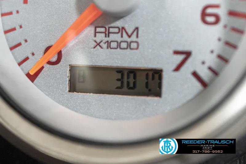 Slide: The Image of Close-up of a 2006 Bennington 2250RL RPM gauge displaying 301.7 hours. - 34