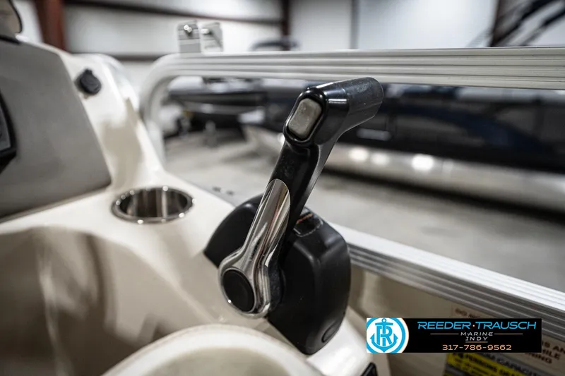 Slide: The Image of Close-up of a 2006 Bennington 2250RL boat throttle control in a showroom. - 37