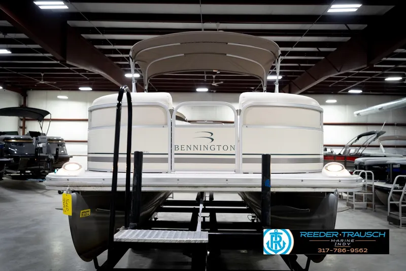 Slide: The Image of 2006 Bennington 2250RL pontoon boat in indoor showroom, front view. - 4