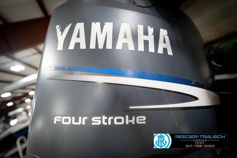 Slide: The Image of Yamaha four-stroke engine on a 2006 Bennington 2250RL boat, Reeder-Trausch Marine logo visible. - 49