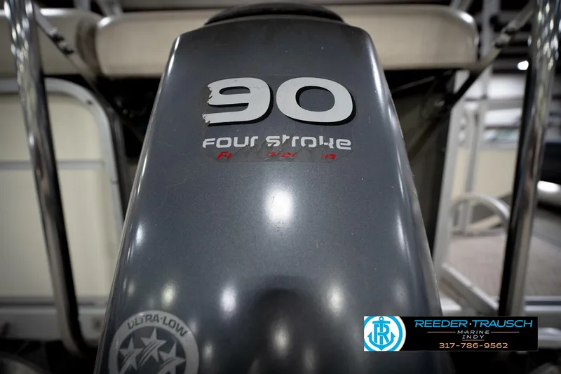 Slide: The Image of Close-up of a 90 horsepower four-stroke engine on a 2006 Bennington 2250RL boat. - 50