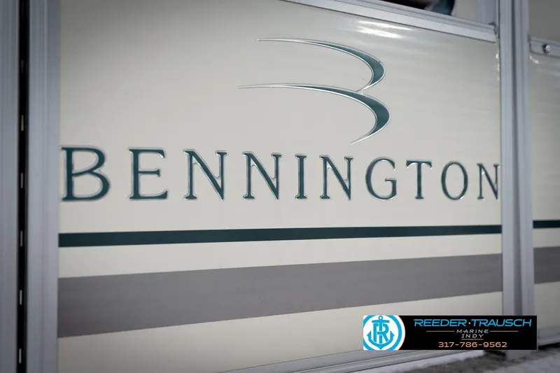 Slide: The Image of Close-up of 2006 Bennington 2250RL boat logo with Reeder-Trausch Marine contact details. - 52