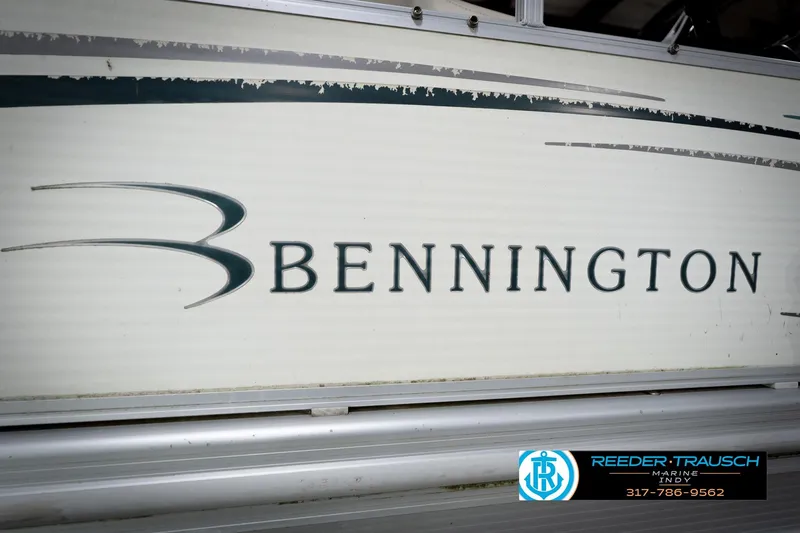 Slide: The Image of 2006 Bennington 2250RL boat side view with logo and dealership contact information. - 53