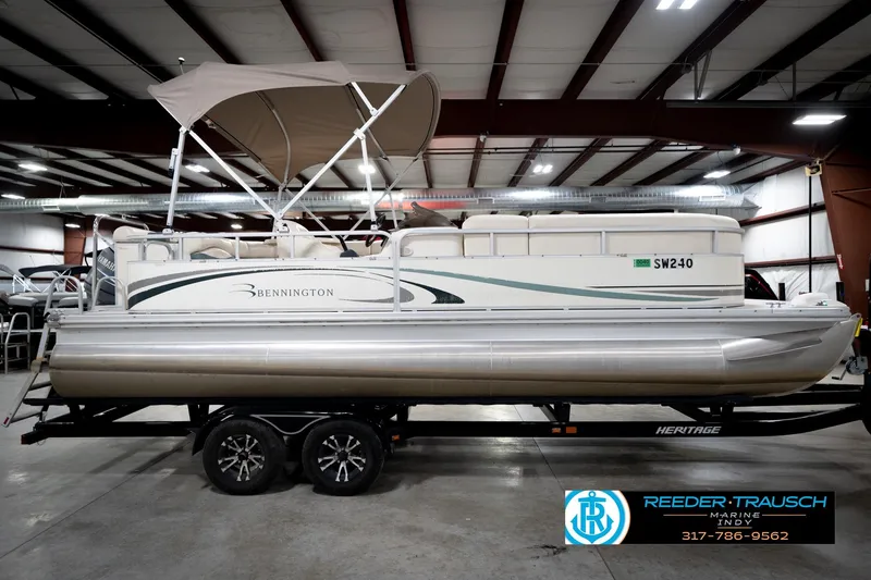 Slide: The Image of 2006 Bennington 2250RL pontoon boat with canopy in indoor showroom. - 6