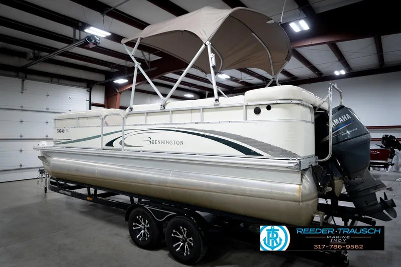 Slide: The Image of 2006 Bennington 2250RL pontoon boat with Yamaha outboard motor in indoor storage. - 9