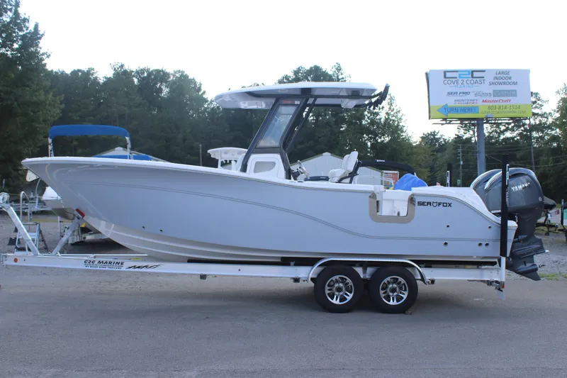 The Image of 2026 Sea Fox 268 Commander boat on trailer, parked outdoors. - 0