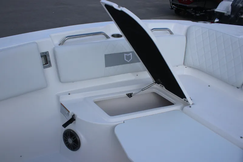 Slide: The Image of 2026 Sea Fox 268 Commander boat interior with open storage compartment and cushioned seating. - 10