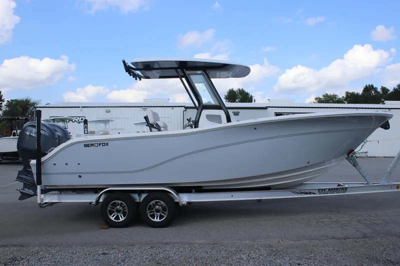 Slide: The Image of 2026 Sea Fox 268 Commander boat on trailer, side view, outdoors. - 4