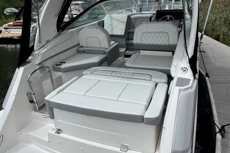 Slide: The Image of 2026 Regal 26 XO boat interior with luxurious white seating and modern design. - 10