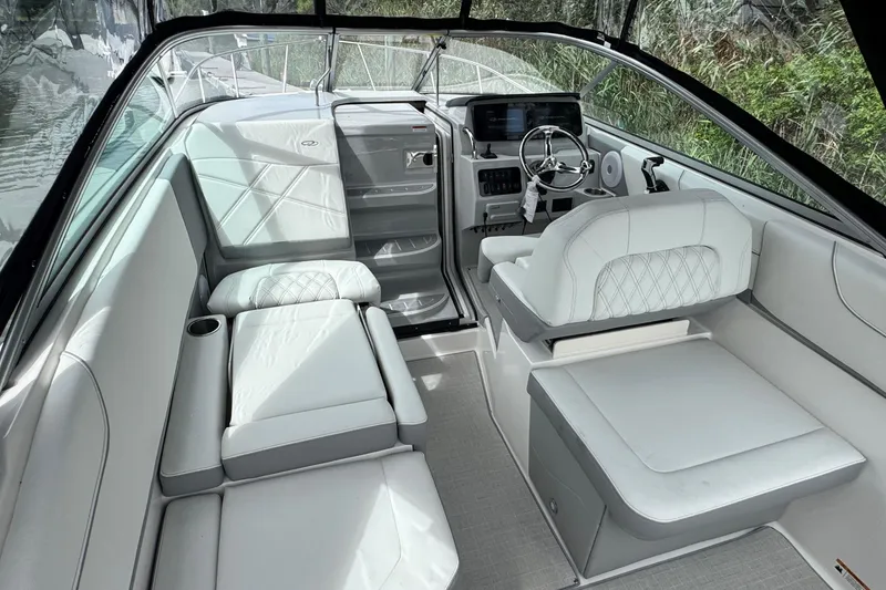Slide: The Image of Luxurious interior of 2026 Regal 26 XO boat with plush seating and modern dashboard. - 14