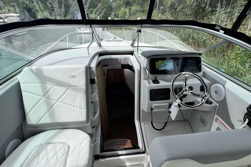 Slide: The Image of 2026 Regal 26 XO boat interior with modern dashboard and steering wheel. - 20