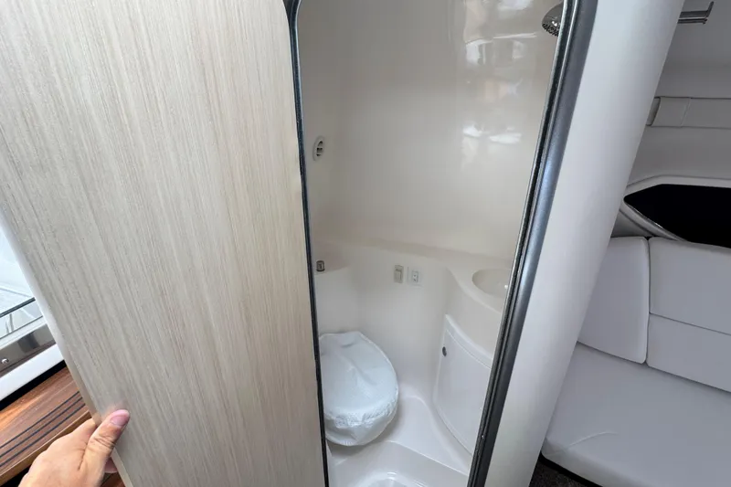 Slide: The Image of 2026 Regal 26 XO boat interior with compact bathroom and modern design. - 24
