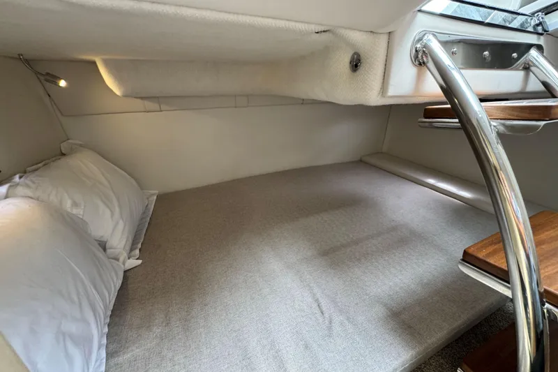 Slide: The Image of 2026 Regal 26 XO cabin interior with cozy bed and modern design. - 31