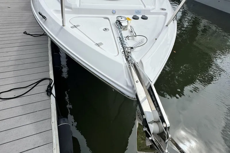 Slide: The Image of 2026 Regal 26 XO boat docked, showcasing sleek bow design and anchor system. - 32