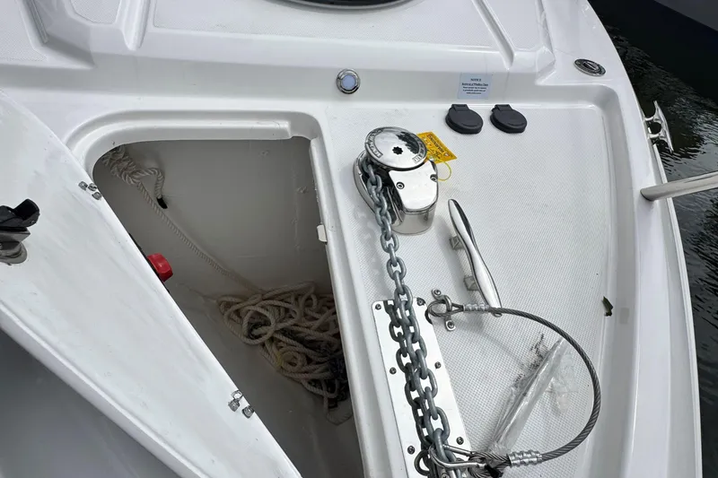 Slide: The Image of 2026 Regal 26 XO boat anchor locker with chain and rope storage. - 33