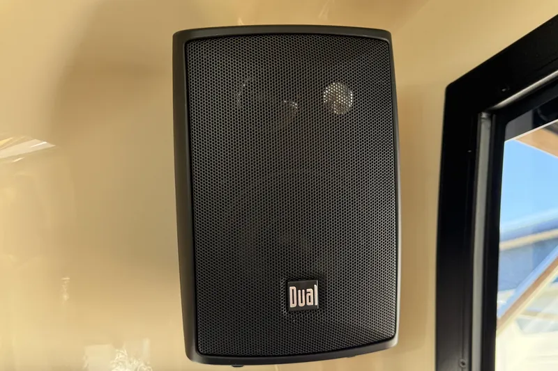 Slide: The Image of Speaker inside 2026 Ranger Tugs R-25 boat, featuring Dual brand audio system. - 24