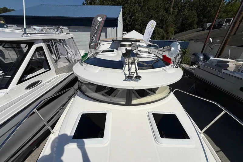 Slide: The Image of 2026 Ranger Tugs R-25 boat with sleek design and modern features, docked outdoors. - 30