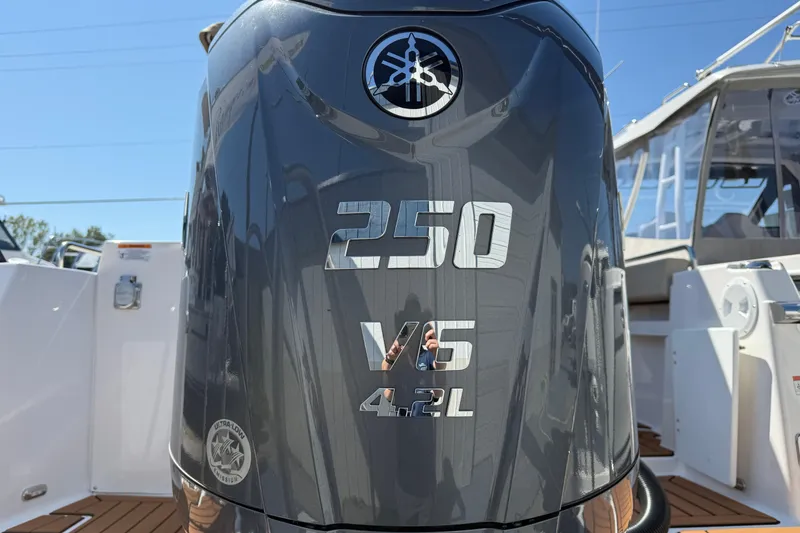 Slide: The Image of 2026 Ranger Tugs R-25 boat with Yamaha 250 V6 4.2L outboard engine. - 31