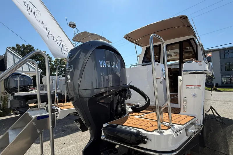 Slide: The Image of 2026 Ranger Tugs R-25 with Yamaha V6 engine, docked and ready for adventure. - 32