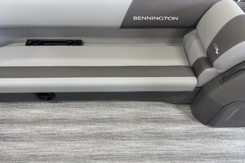 Slide: The Image of 2026 Bennington 23SL boat interior with gray seating and carpeted flooring. - 7