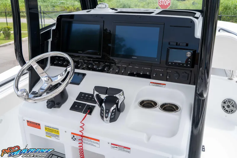 Slide: The Image of 2026 Sea Hunt Gamefish 25 dashboard with dual screens and modern controls. - 24