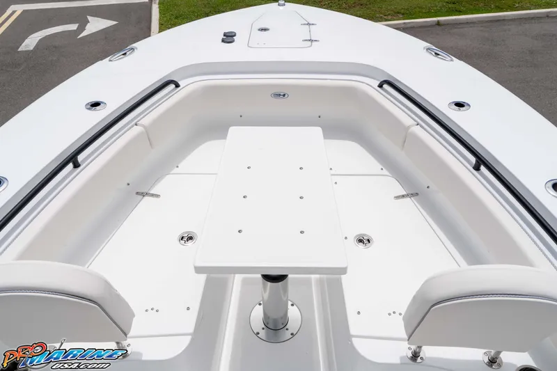 Slide: The Image of 2026 Sea Hunt Gamefish 25 boat interior with seating and table, showcasing modern design. - 28