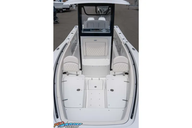 Slide: The Image of 2026 Sea Hunt Gamefish 25 boat interior with white seating and spacious deck layout. - 34