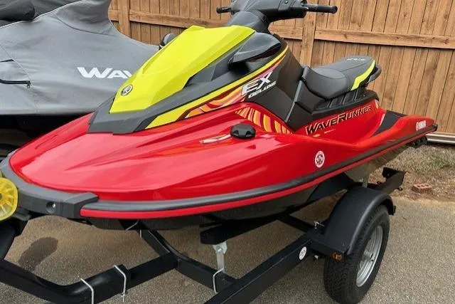 Slide: The Image of 2024 Yamaha WaveRunner EX Limited in red and yellow on a trailer. - 13