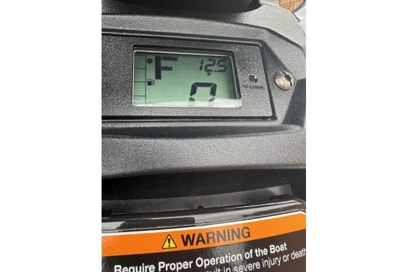 Slide: The Image of Dashboard of 2024 Yamaha WaveRunner EX Limited with digital display and warning label. - 7