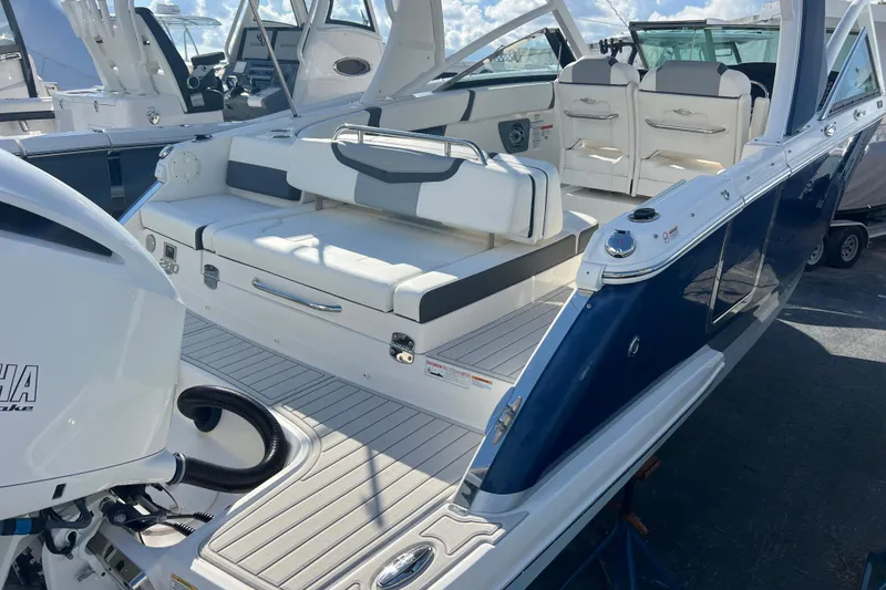 The Image of 2020 Chaparral 280 OSX boat interior with seating and Yamaha engine. - 0