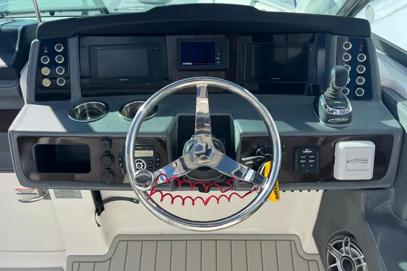 Slide: The Image of Dashboard of 2020 Chaparral 280 OSX boat with steering wheel and controls. - 12
