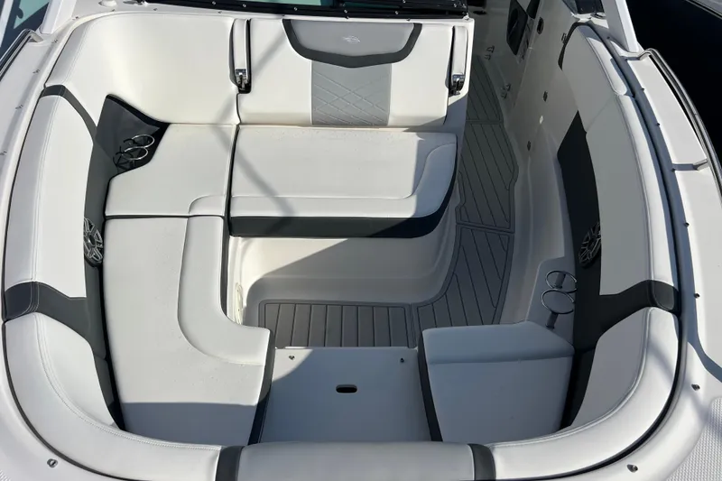 Slide: The Image of 2020 Chaparral 280 OSX boat interior with white and gray seating arrangement. - 14