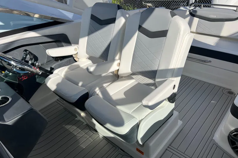 Slide: The Image of 2020 Chaparral 280 OSX boat interior with dual white captain seats. - 17