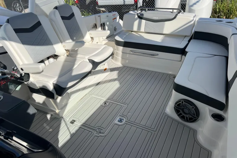 Slide: The Image of 2020 Chaparral 280 OSX boat interior with cushioned seating and modern design. - 20