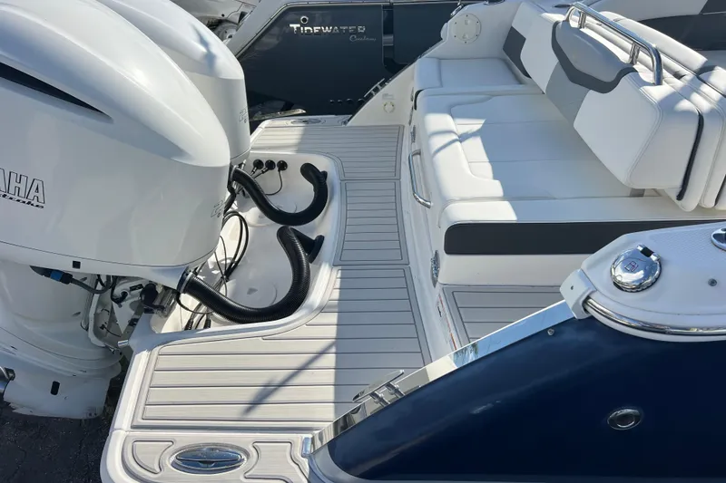 Slide: The Image of 2020 Chaparral 280 OSX boat with Yamaha outboard engines and white seating area. - 5
