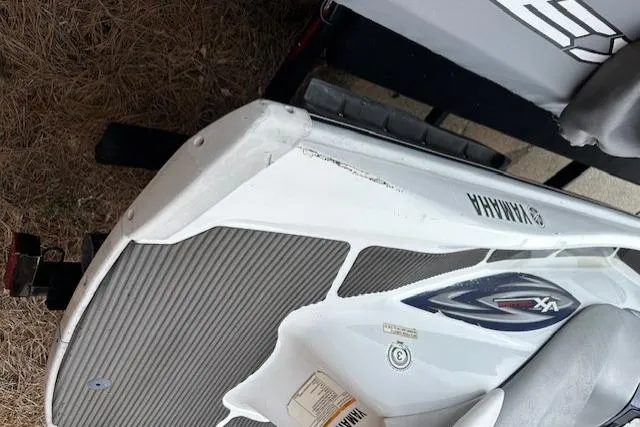 Slide: The Image of 2011 Yamaha WaveRunner VX Deluxe, white and gray, on a trailer. - 10
