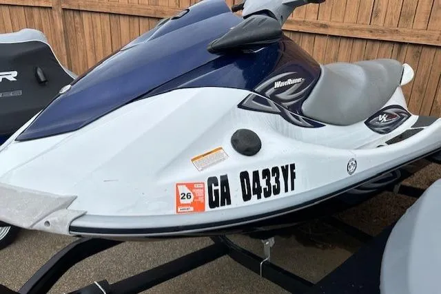 Slide: The Image of 2011 Yamaha WaveRunner VX Deluxe jet ski on trailer, blue and white design. - 14