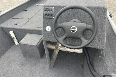 Slide: The Image of 2023 Rhino JET boat interior with steering wheel and control panel. - 4