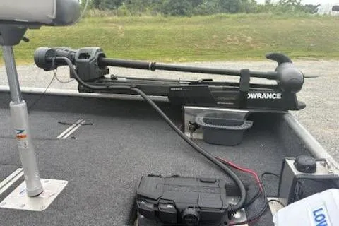 Slide: The Image of Rhino JET 2023 model boat with Lowrance equipment on deck, parked on grass. - 6