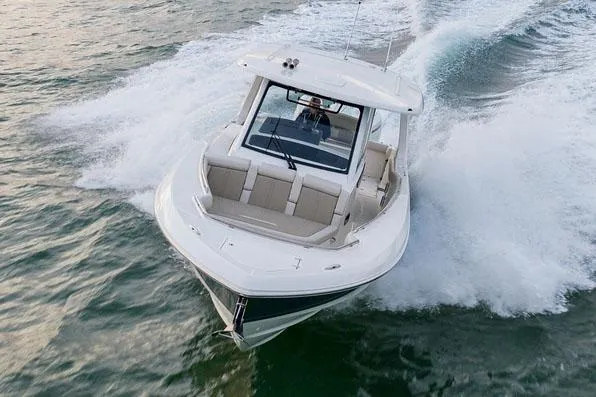 Slide: The Image of Manufacturer Provided Image: 2025 Boston Whaler 350 Realm cruising swiftly on open water. - 1