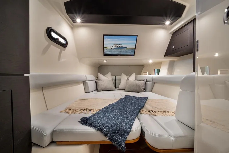 Slide: The Image of Manufacturer Provided Image: Luxurious interior cabin of 2025 Boston Whaler 350 Realm with cozy seating and modern decor. - 12