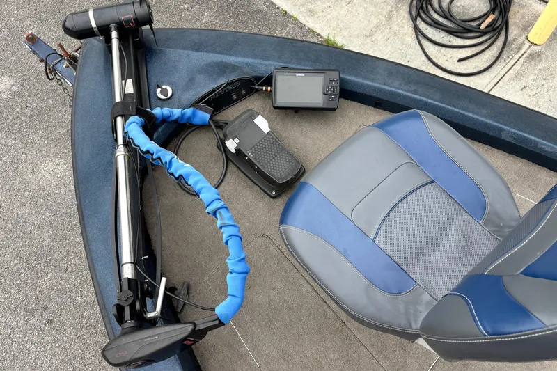 Slide: The Image of 1998 Nitro 800 LXS boat interior with trolling motor, foot pedal, and blue-gray seat. - 2