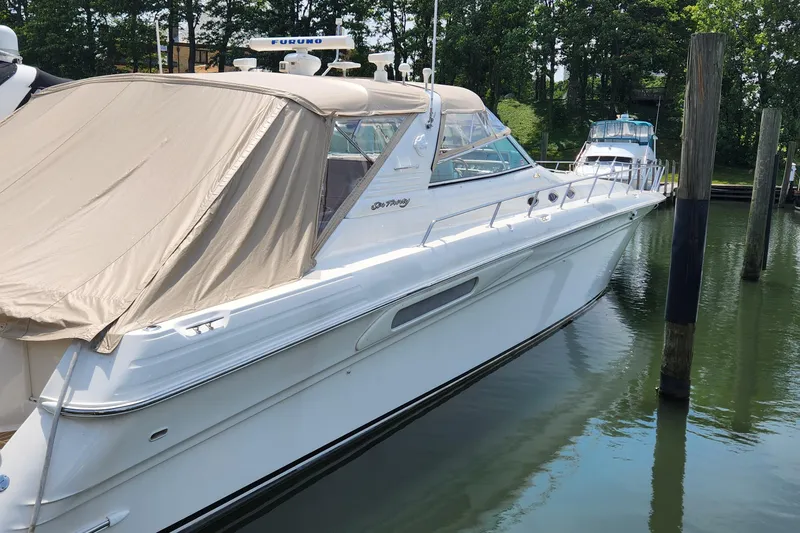 Slide: The Image of 1998 Sea Ray 630 Super Sun Sport yacht docked in a marina. - 1