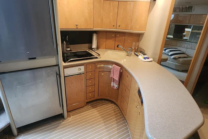 Slide: The Image of Luxurious kitchen interior of 1998 Sea Ray 630 Super Sun Sport yacht. - 18