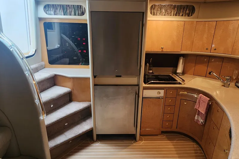 Slide: The Image of Luxurious 1998 Sea Ray 630 Super Sun Sport yacht interior kitchen with modern amenities. - 19