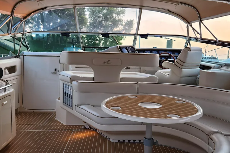 Slide: The Image of Luxurious interior of 1998 Sea Ray 630 Super Sun Sport yacht with elegant seating and helm. - 2