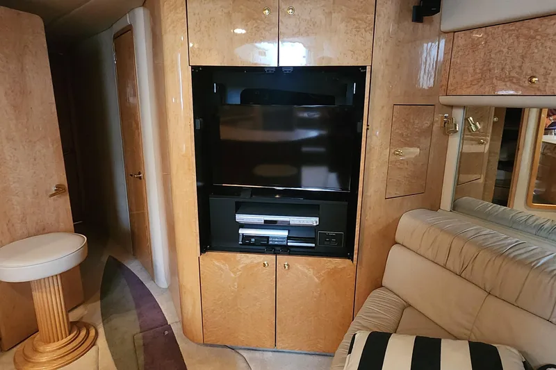 Slide: The Image of Luxurious interior of 1998 Sea Ray 630 Super Sun Sport yacht with entertainment center. - 20