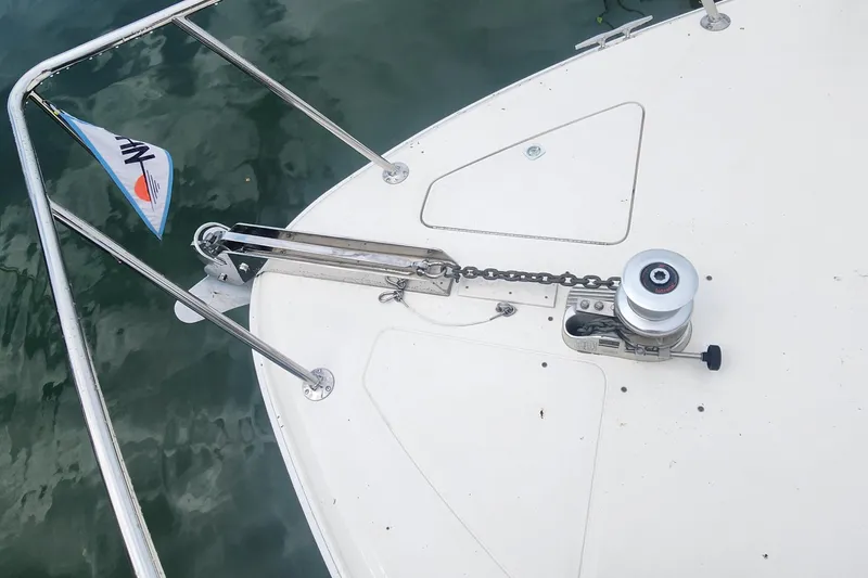 Slide: The Image of Bow of 1998 Sea Ray 630 Super Sun Sport with anchor chain and winch. - 31