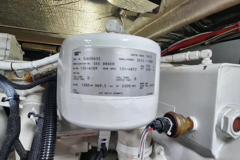 Slide: The Image of Engine compartment of a 1998 Sea Ray 630 Super Sun Sport with CAT engine details. - 37